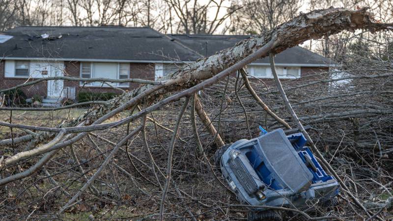 MADISON, TENNESSEE - DECEMBER 10: A child's ride-on vehicle is seen amongst downed tree branches in the aftermath of a tornado on December 10, 2023 in Madison, Tennessee. Multiple long-track tornadoes were reported in northwest Tennessee on December 9th causing multiple deaths and injuries and widespread damage. (Photo by Jon Cherry/Getty Images)
