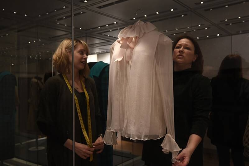 The blouse and a dress Diana wore are set to be auctioned next month.