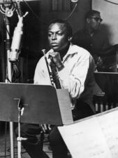 American jazz trumpeter and composer Miles Davis (1926 - 1991), sits with his instrument during a studio recording session, October 1959. (Photo by Hulton Archive/Getty Images)