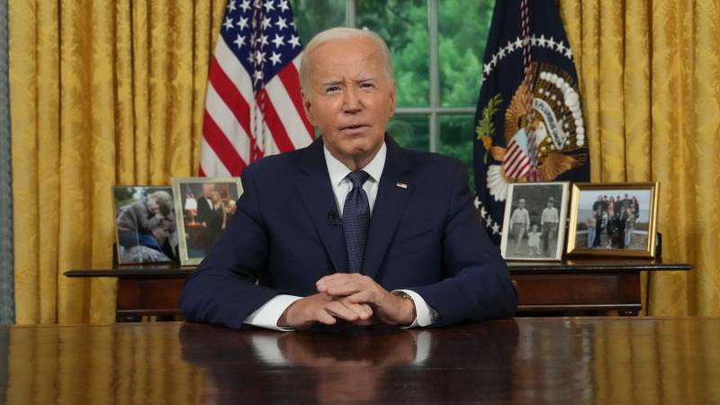 President Joe Biden in the Oval Office addressing the nation